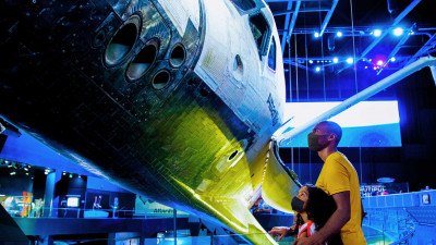 SPACE SHUTTLE ATLANTIS®
You can’t miss the entrance to the home of space shuttle Atlantis: a mighty full-scale space shuttle stack of two solid rocket boosters and orange external tank. Inside, Atlantis is displayed as only astronauts  – provided by Kennedy Space Center